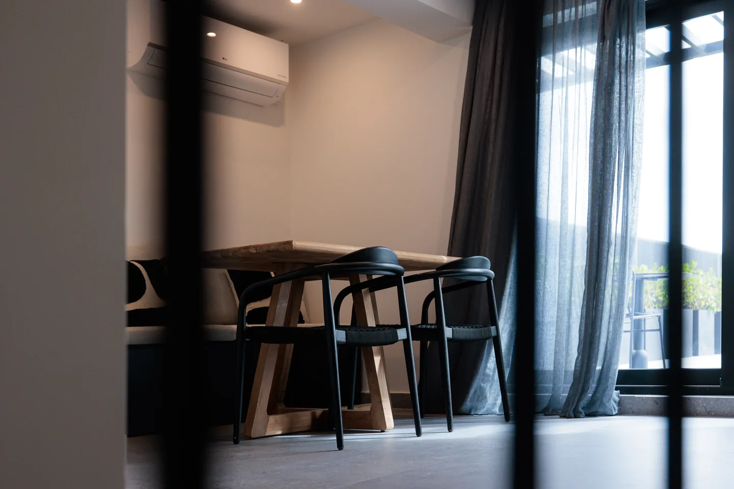 The Penthouse at FŌS — open living, kitchenette beyond.